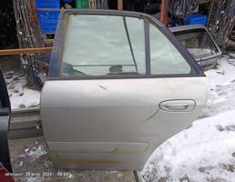 Дверь задняя левая для Mazda Capella GF (1997—2002)  запчасти бу